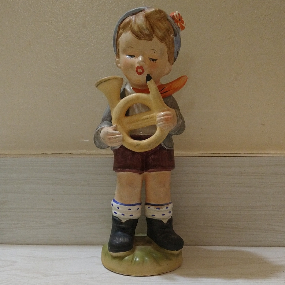 Vintage 1950s Arnart 5th Ave figurine featuring a boy holding a horn